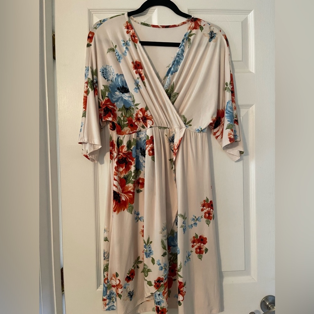 Cream Floral Faux wrap dress. Above the knee. Large. Elbow length sleeve.